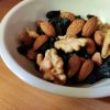 brown and black nuts on white ceramic bowl