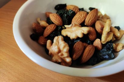 brown and black nuts on white ceramic bowl